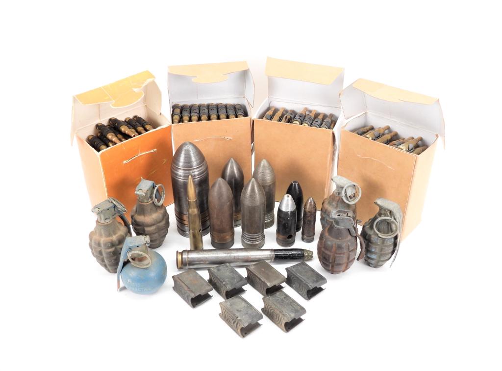 Group of Inert Ordnance and Blank Rounds: Four boxes of lake City .30-06 blanks on links; six inert grenades, six M1 Garand enbloc clips; and other inert cartridges.