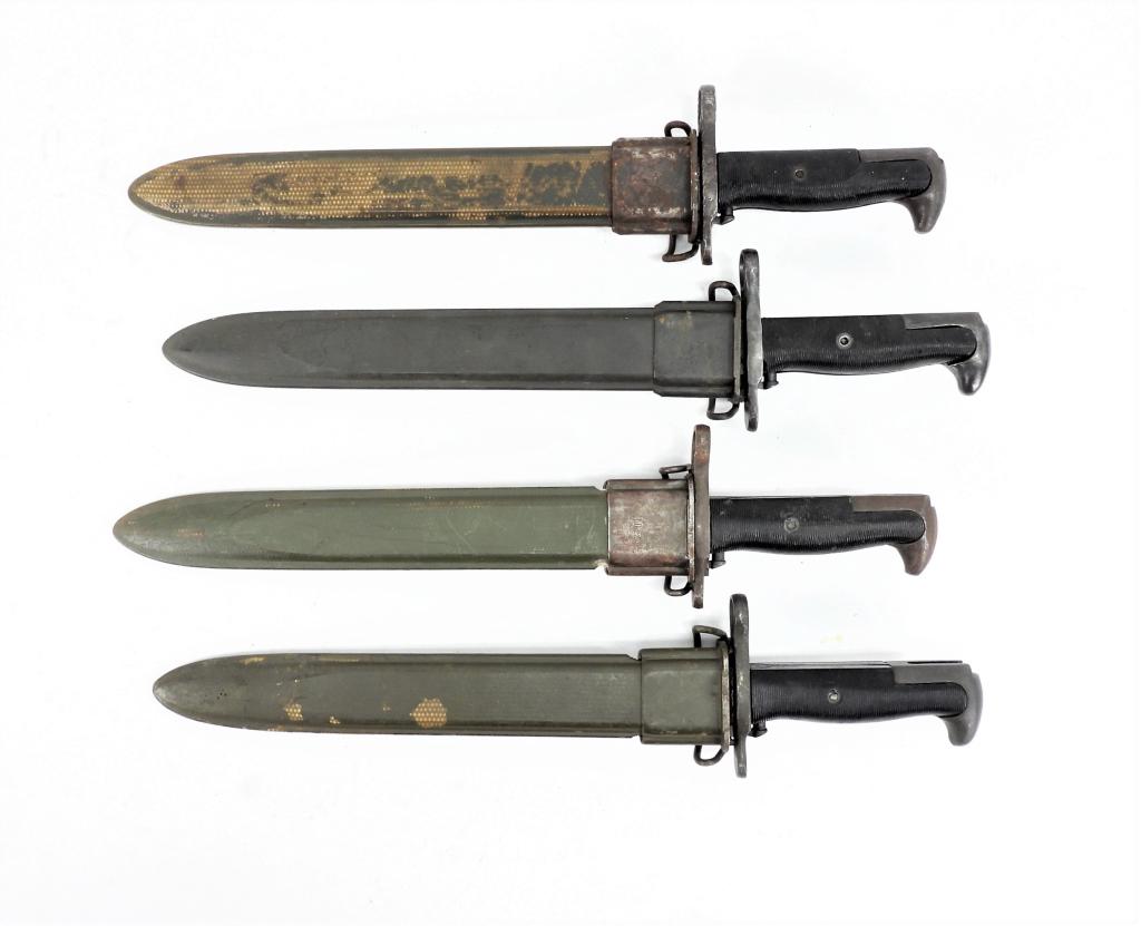 Four WWII U.S. M1 Garand Bayonets and Scabbards: United States A bayonet marked "PAL/US" with a scabbard; a bayonet marked "U.C./US" with a scabbard; a bayonet marked "U.C./US" with a scabbard; and a bayonet marked "AFH/US" with a scabbard. Blade lg