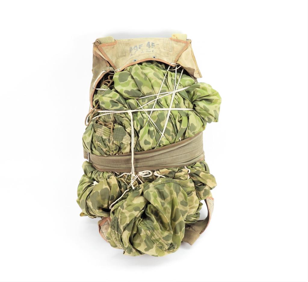 U.S. WWII T-7 Parachute: Camouflage parachute with pack tray (missing front cover), with quick release clip.