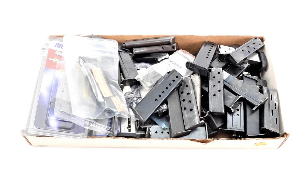 Approximately Sixty-seven Pistol Magazines: Large group of approximately sixty-seven magazines including a pre-war Colt Woodsman two tone magazine; HK .380; 9mm Zastava, Tokarev, Sig Sauer P6; Sig Sauer P-238; Astra; Colt .380 Mustang, Femaru; 