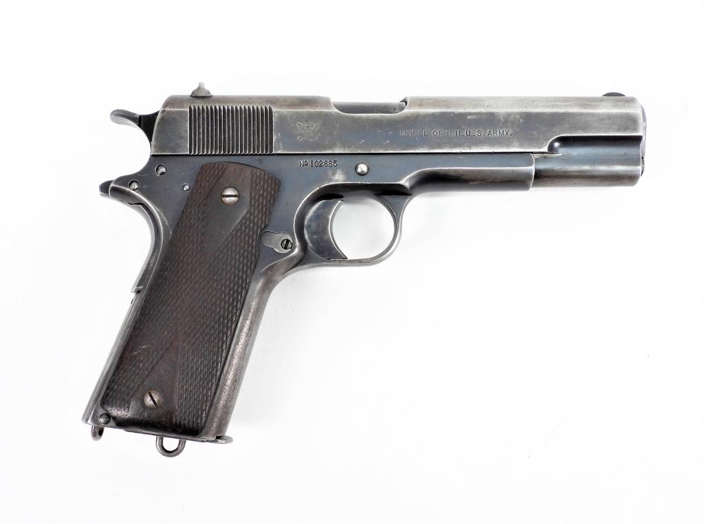 Springfield Armory Model 1911 Pistol: United States .45 ACP, serial number 102885, checkered walnut grips, blued finish, marked on the right side of the slide with en eagle and "MODEL OF 1911 U.S. ARMY.", marked on the left side of the sl