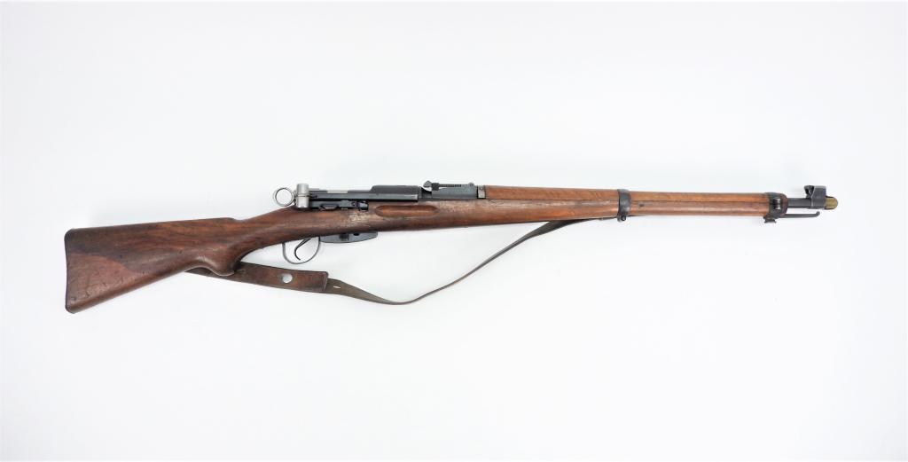Swiss K31 Schmidt-Rubin Short Rifle: Switzerland C. 1940/41 7.5x55 caliber, serial number 608633, walnut stock, blued finish, marked on the top of the receiver ring with a shield and Swiss cross, with a leather sling and sight cover. Not