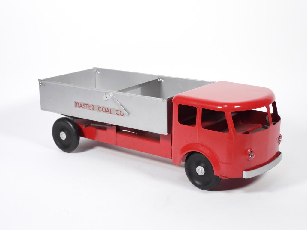 Restored Steelcraft Master Coal Co. Dump Truck: Ohio,Early 20th Century Steelcraft pressed steel Master Coal Co. dump truck, toy was restored at one time, now shows minor signs of aging, paint chipping where bed moves on truck frame, features batte