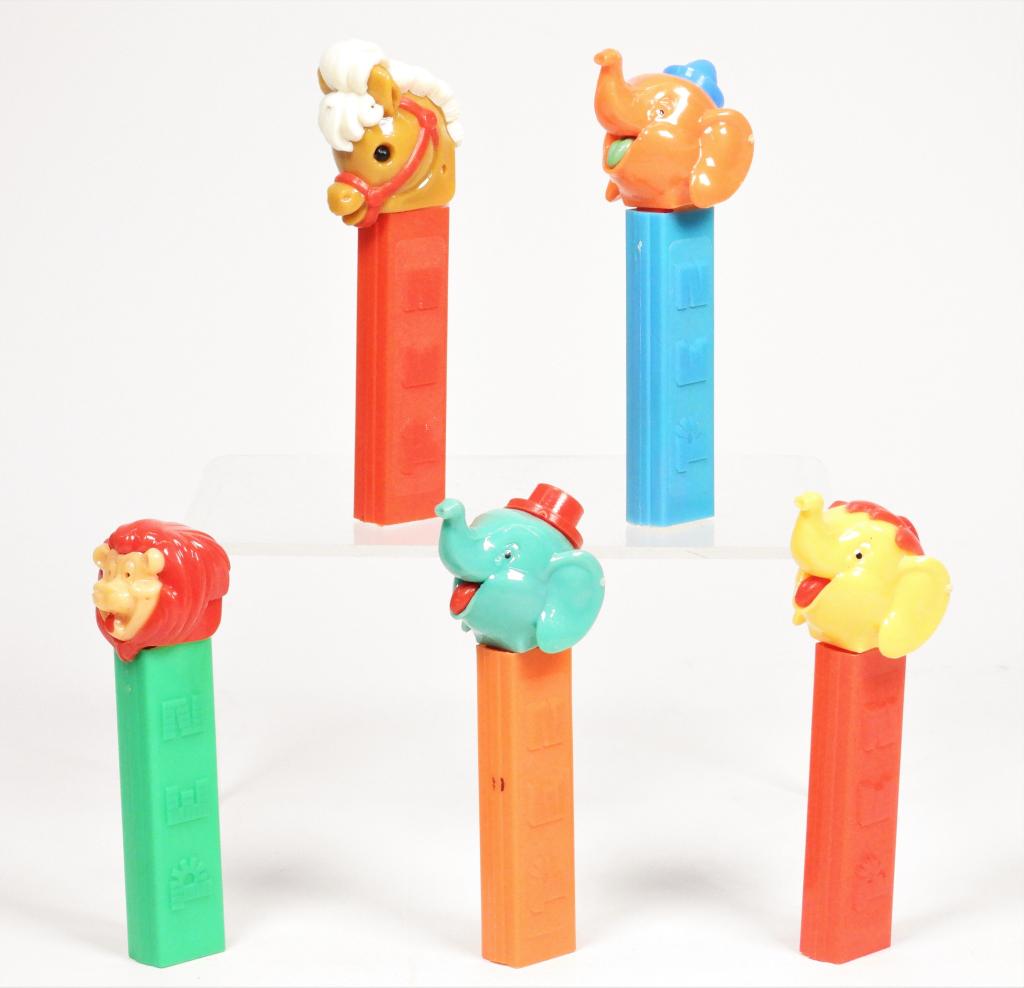 5PC 1970-76 PEZ 2.62 No Feef Dispenser Group: Austria,1970-1976 Group includes 1970 model Pony with red stem,1970 model Lil' Lion with green stem, 1970 model Elephant with Hair and red stem, and two 1976 model Elephant, one with pointed hat the o