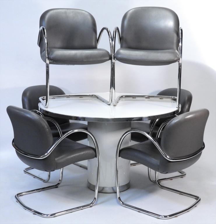 Stanley J. Friedman Brueton Chrome Table & Chairs: Stanley J. FriedmanUnited States 20th Century Round white top table over cylindrical column base with six chrome and gray leather chairs. Table 29 1/2" x 30" dia.Chair 32" t x 22" w x 20" d,Chrome, lu