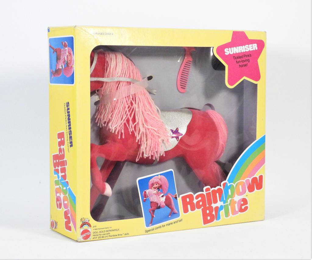 1983 Mattel Rainbow Brite Sunriser Factory Sealed: United States,1983 1983 Mattel Rainbow Brite Sunriser, factory sealed with light to moderate wear including corner and edge wear, light creasing and crushing in areas, surface wear to back of box, ove