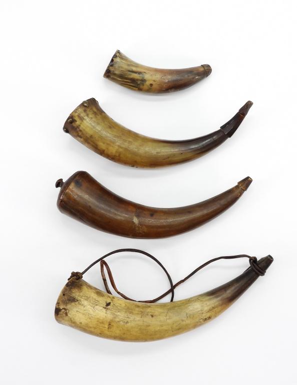Group of Powder Vessels: Four plain powder horns of various sizes, all with wooden plugs. . From the collection of William "Billy" McMillen.