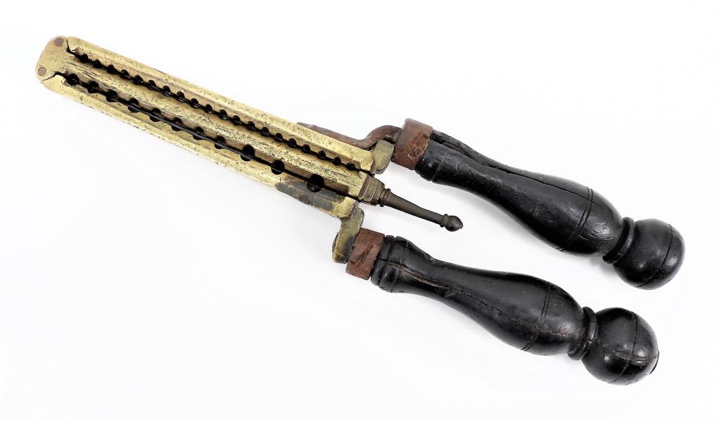 Revolutionary War-era Brass Ball and Shot Mold: United States C. mid to late 18th century A brass gang mold made for a fowling piece with a cavity for a .60 caliber ball, a .50 ball, a .44, as well as a variety of buck and bird shot, and a folding