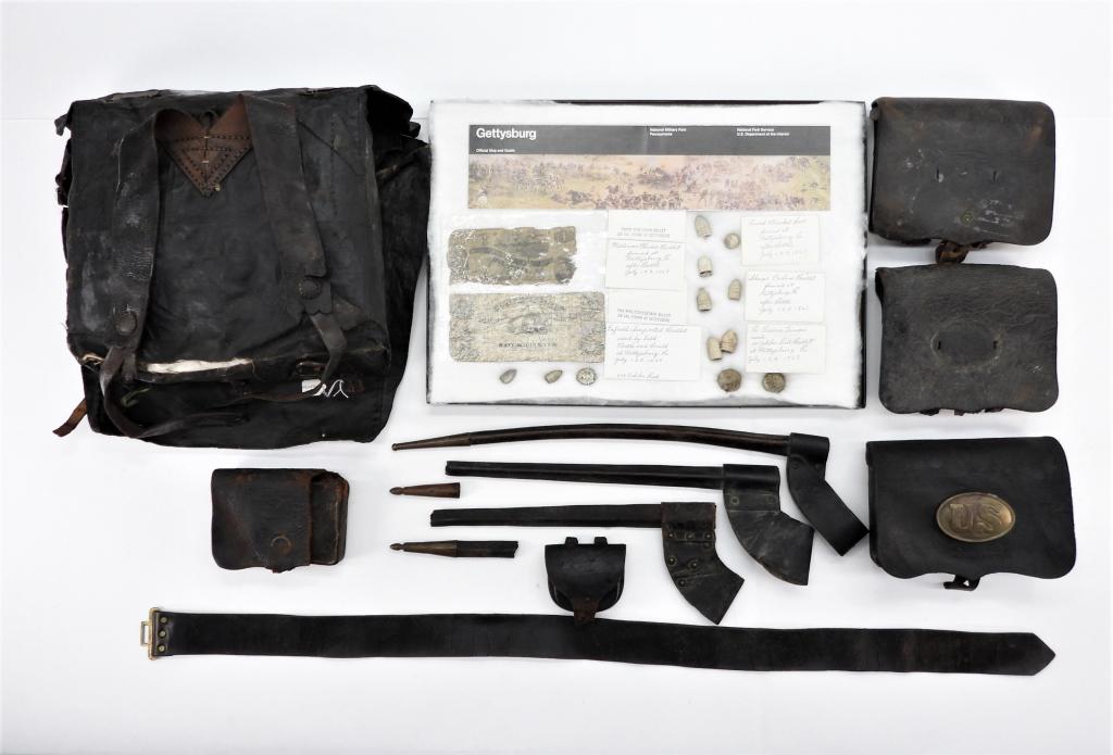 Group of Civil War-era Accouterments: United States C. mid to late 19th century A Model 1855 double bag knapsack; a cap box; three cartridge boxes, one with a box plate; a pistol cartridge box (damage); three bayonet scabbards (one with a