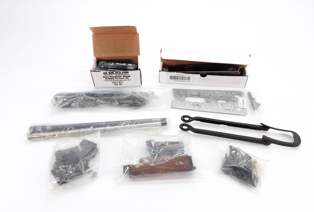 Yugoslavian M70 AK Parts Kit: An M70 AK parts kit with folding stock, wooden hand guard, small parts, new US made barrel, used barrel, a folded 80% receiver, a flat 80% receiver, drilling jig, 5 and 7mm reamers, and rivet set..FFL