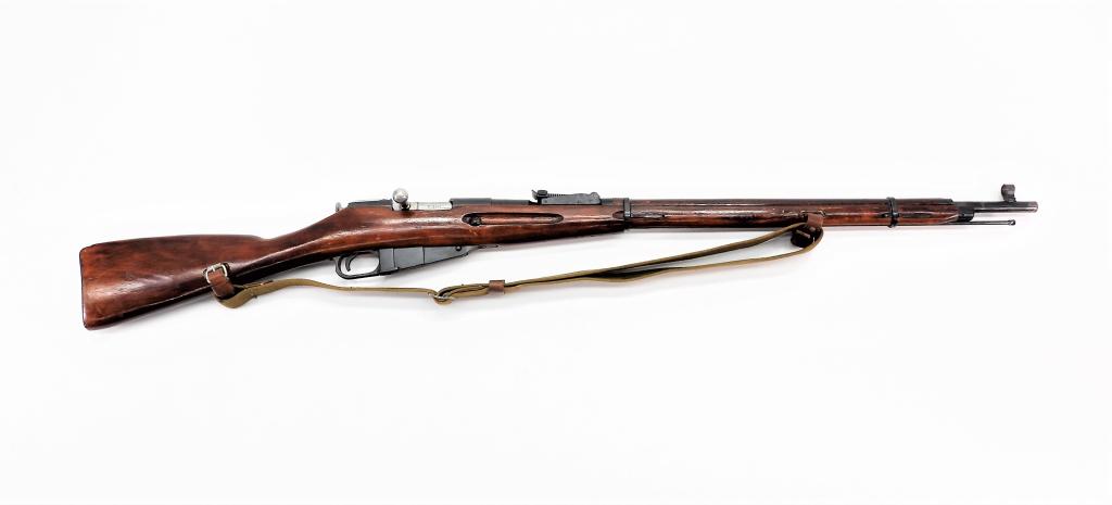 Russian Model 91/30 Mosin-Nagant Rifle: Russia C. 1942 7.62x54R, serial number CE3894 with matching bolt, magazine, and butt plate, walnut stock, blued finish, marked on the base of the barrel Izhevsk Arsenal mark and "1942", with a cleanin