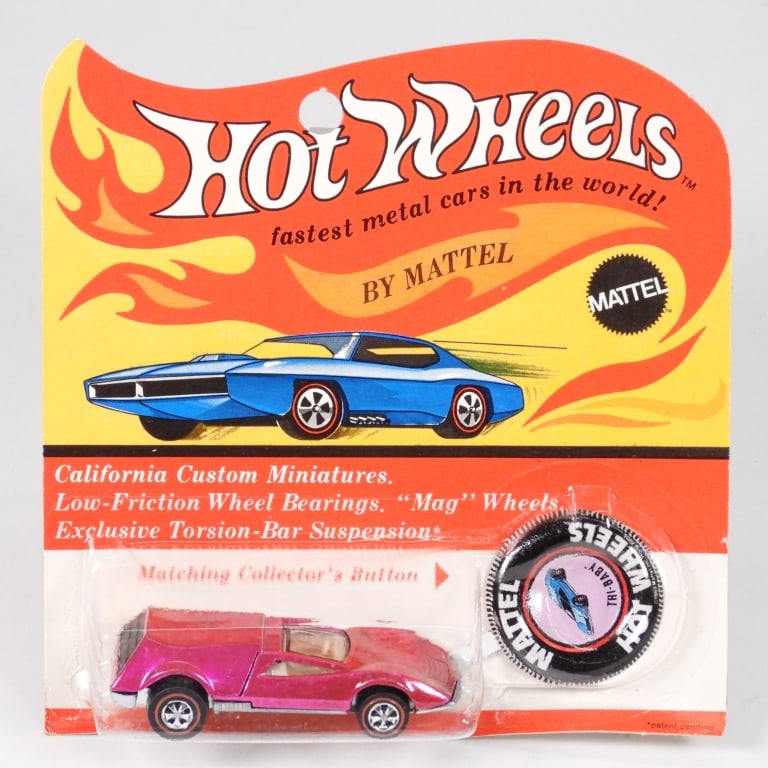 1970 Mattel Hot Wheels Redline Tri Baby Pink MOSC: United States,1970 1970 Mattel Hot Wheels Redline Tri-Baby diecast car, pink color, C8 factory sealed with light wear as expected from age and storage, corner and edge wear with curl to bottom, clear