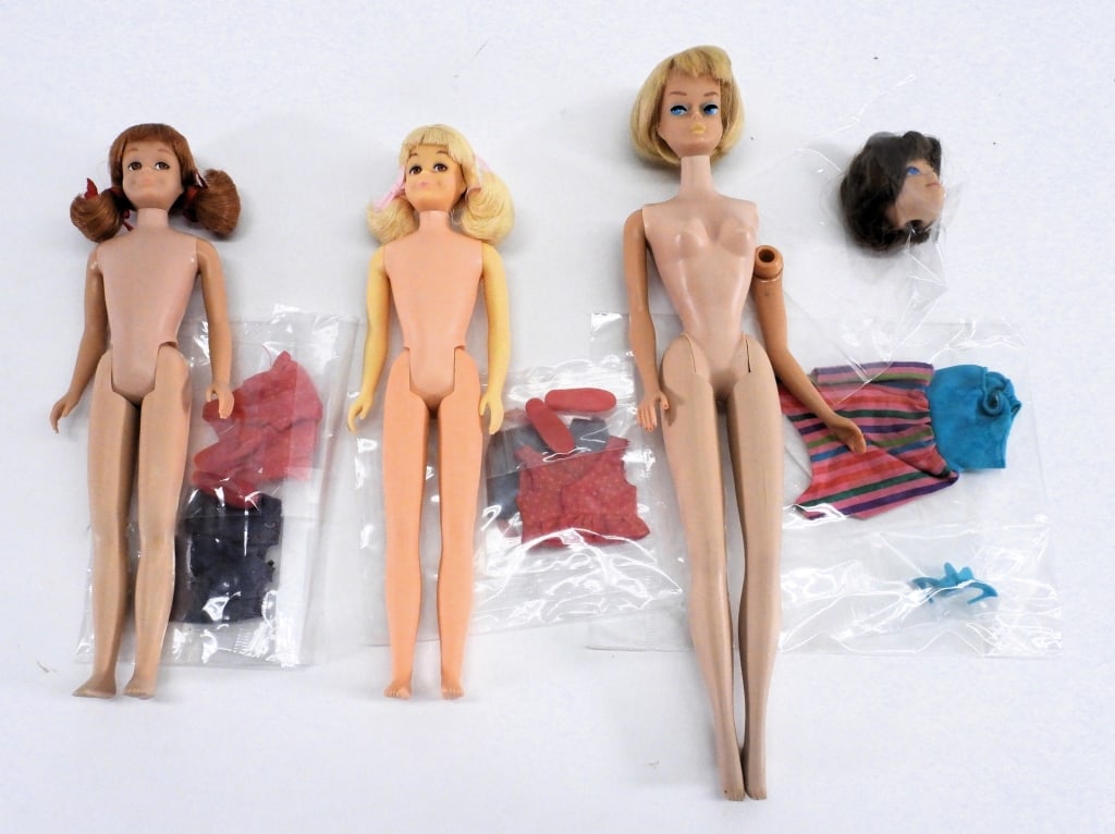 1965-66 Mattel American Girl Barbie Skooter Group: United States,1965-1966 Group includes 1965-1966 Mattel Barbie Blonde Bend-Leg Skooter doll with original suit and shoes, Redhead Bend-Leg Skooter doll with original suit, shoes, and hair set with bow