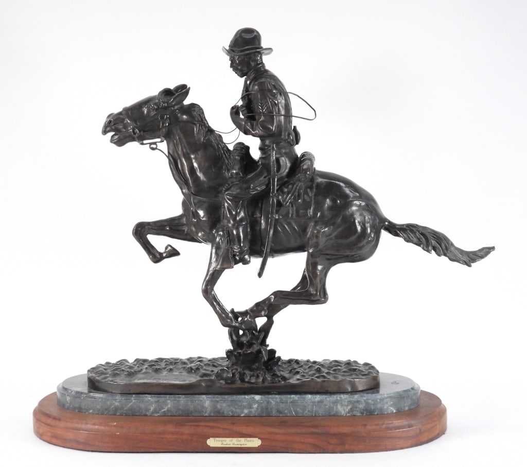 LG Aft. Frederic Remington Bronze Cowboy Sculpture: United States,20th Century Depicts a cowboy on horseback holding a pistol modeled after Remington's "Trooper of the Plains." Metal, stone, wood Signed "Frederic Remington" on base. From the collection
