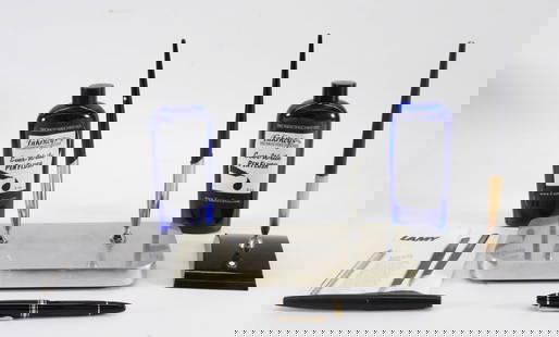 6PC Montblanc Fountain Pens: Germany,20th Century Includes two Montblanc black fountain pens in a William Sklaroff stand, a black fountain pen with 14K gold nib in a matching Montblanc stand, a black Montblanc Meisterstuck pen wi
