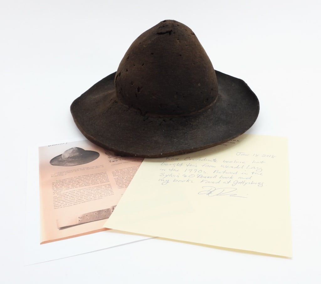 Confederate Beehive Slouch Hat From Gettysburg: United States,C. 1862-63 Brown wool felt beehive-style slouch hat with the string mark from blocking the hat, picked up at Gettysburg by a New York soldier, with a note from Don Troiani when it left h