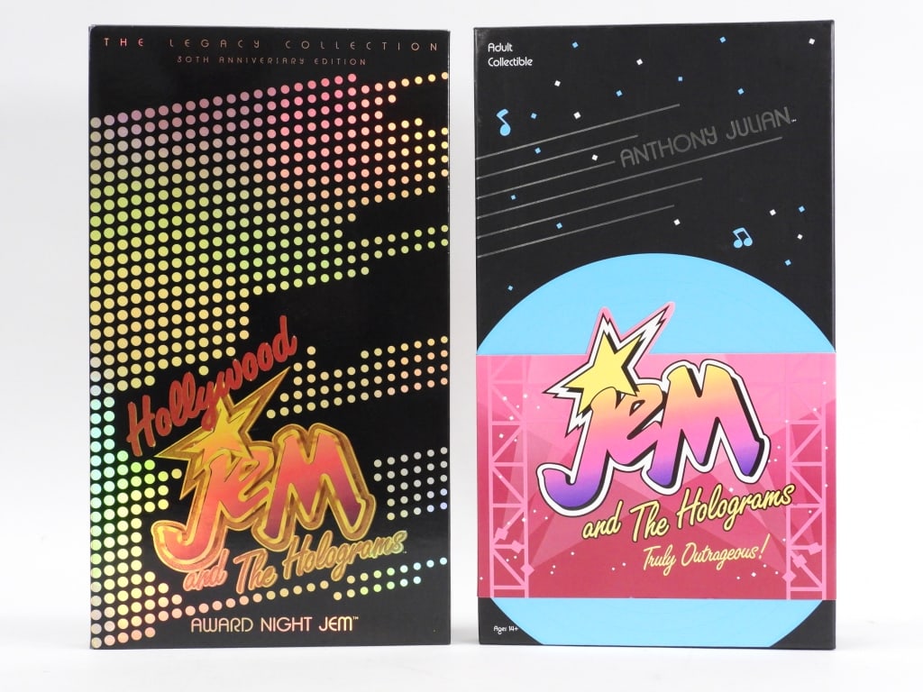 2 Integrity Toys Hasbro Jem and The Holograms Doll: United States 2014-2015 Group includes 2014-2015 Integrity Toys Hasbro Jem and The Holograms Jem and Anthony Julian dolls, both in new, unused condition with sealed contents appearing to have only bee