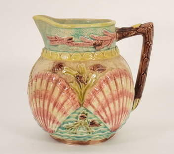 Aft. Wardle & Co Shell & Seaweed Majolica Pitcher: England,19th Century Squat pitcher with raised pink shell and green seaweed design with a band of pink coral and shell design around neck. Approx. 7" t x 7" w x 6" d. From the Mendon Historical Societ