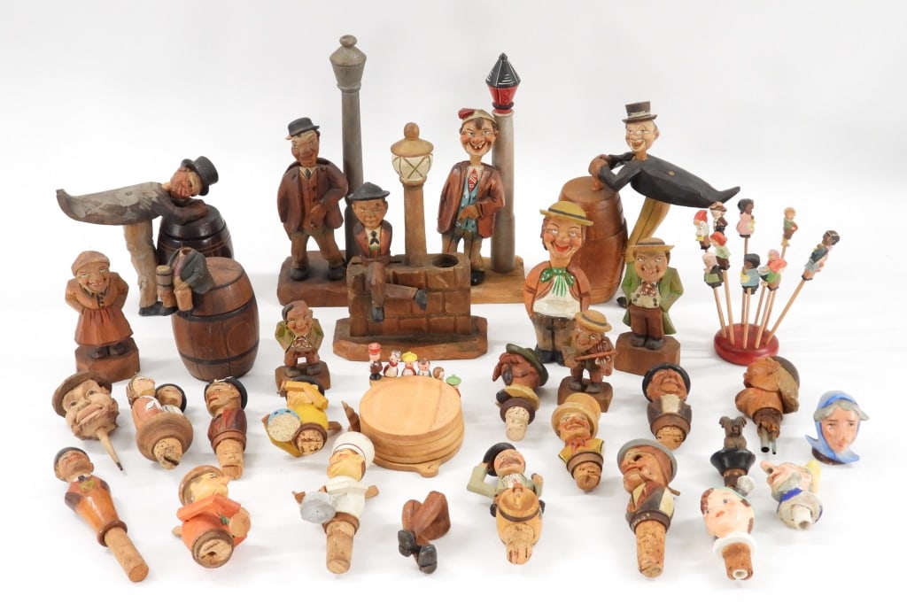 Collection of Anri Italian Wood Carved Bar Figures: Italy 20th Century Includes an array of over twenty figures, tooth picks, containers, corks, and bottle openers of varying sizes and shapes depicting an array of cartoonish characters. Wood,Smallest 3
