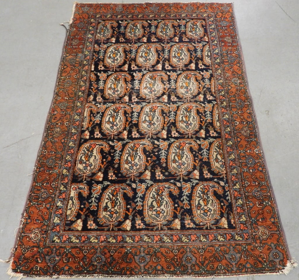 Antique Malayar Rug: Middle East Circa 1910 Orange, blue, navy blue, and ivory repeating geometric floral pattern over navy field surrounded by geometric floral borders. Wool,Approx. 6' 1" x 3' 8". From the collection of 