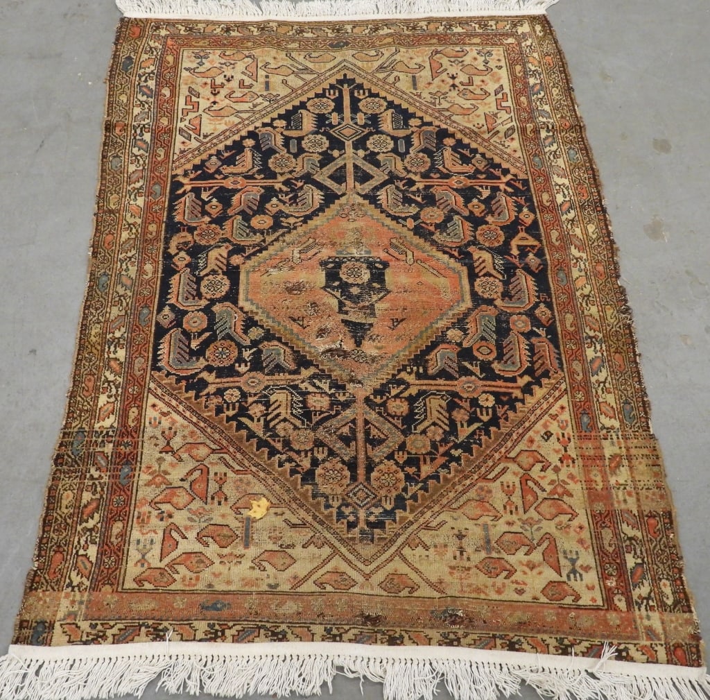 Antique Geometric Hamadan Rug: Middle East Early 20th Century Tan, ivory, red, blue, and navy blue central medallion over navy blue field surrounded by geometric borders. Wool,Approx. 4' 2" x 6'. From the collection of a Salem, Mas