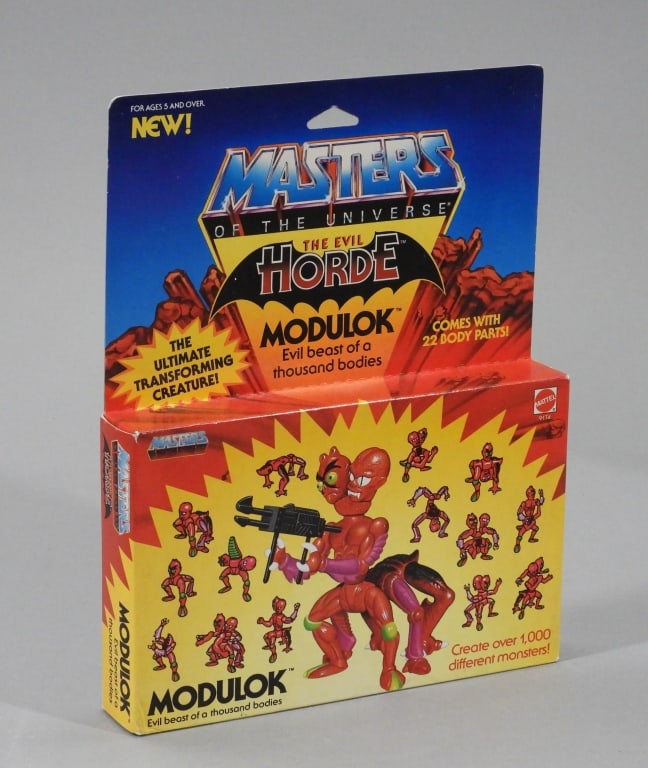 1985 Mattel Masters of the Universe Modulok MISB: United States,1985 1985 Mattel Masters of the Universe Modulok, C7.5+ factory sealed with light to moderate wear as expected from age and storage, bottom left corner with subtle crush and creasing, co