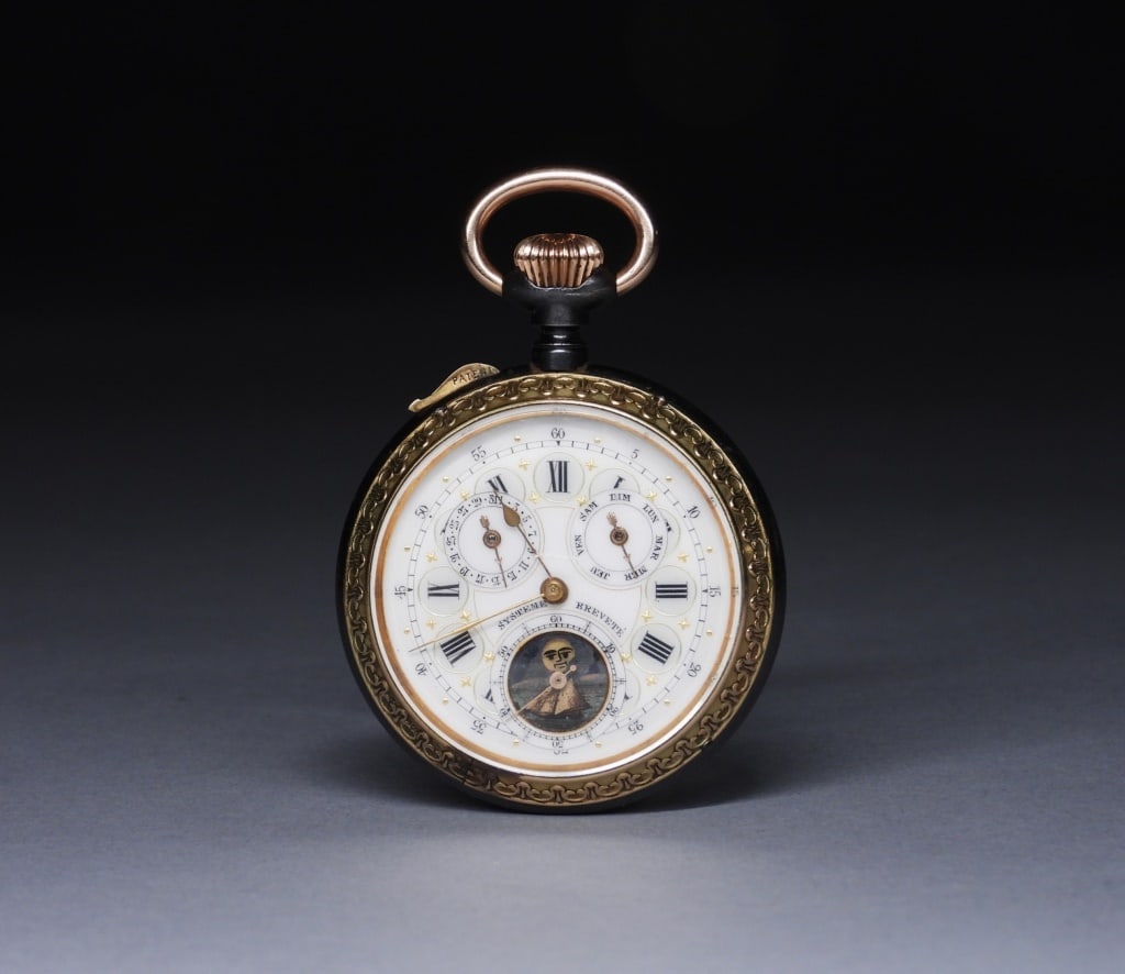 Swiss Chronograph Minute Repeater Pocket Watch: Switzerland,Late 19th-Early 20th Century Nickel finished movement with white enamel dial with Roman Numeral chapter marks, gold hands, three subsidiary dials indicating days, date, and seconds, with m