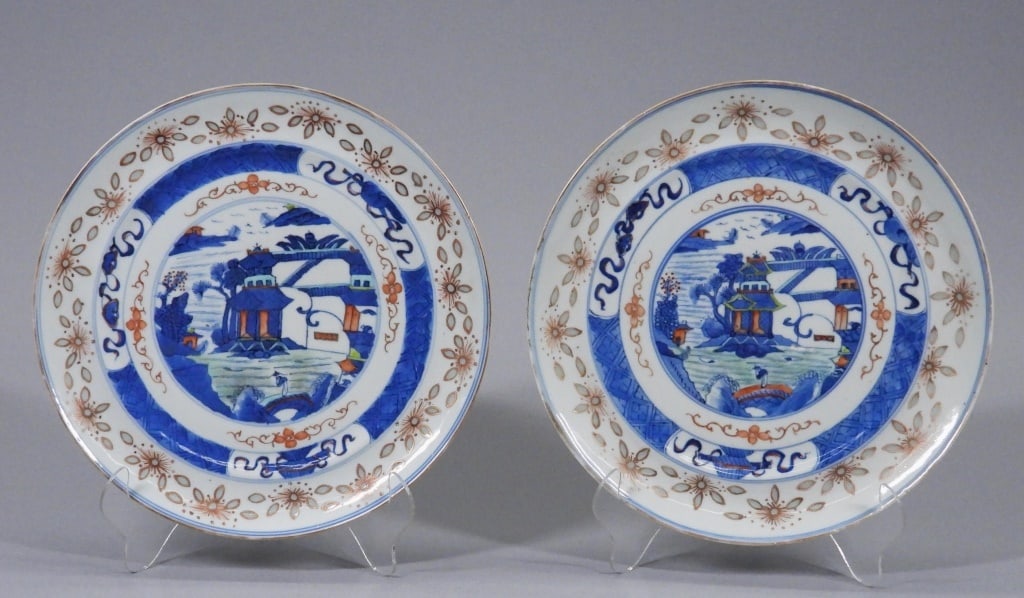 PR 19C. Chinese Qing Rice Pattern Porcelain Plates: China,Qing Dynasty Blue, green, and red architectural landscape centers surrounded by botanical borders and rice pattern rims. Porcelain,Each 9 3/4" dia.. From the collection of a Jamestown, Rhode Isl