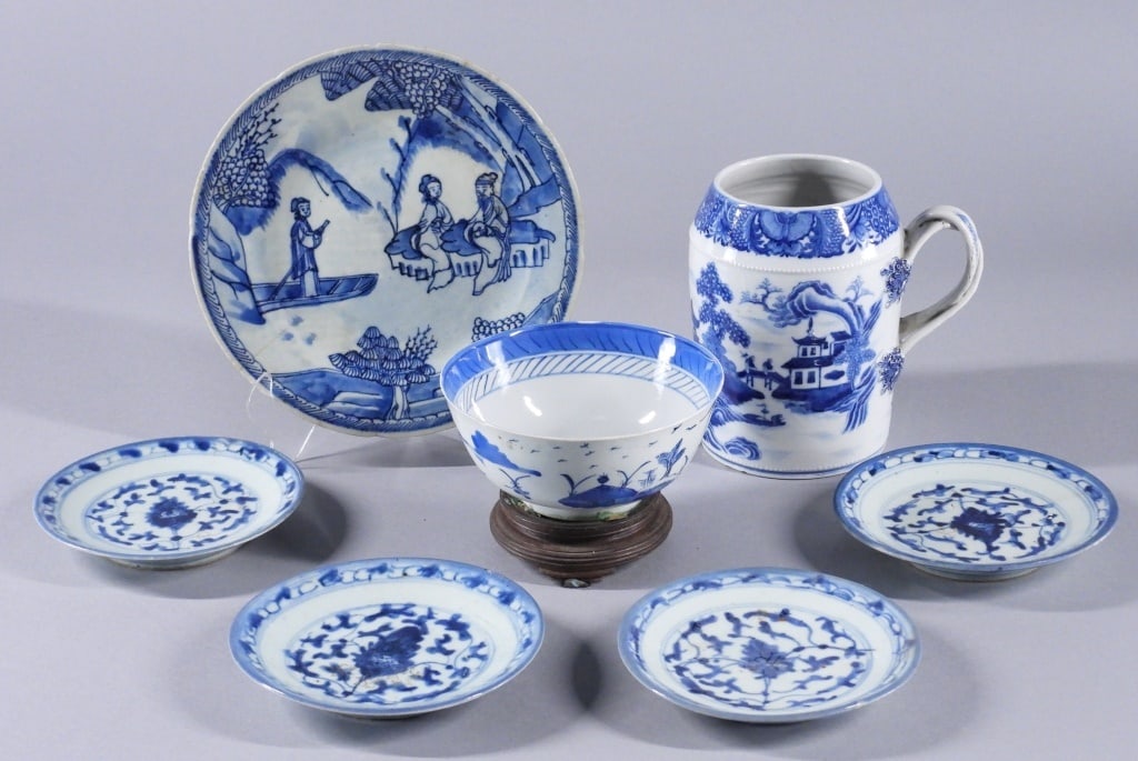 7PC Chinese 19C. Blue & White Export Porcelain: China,Qing Dynasty Includes a set of four small plates with tendril design, a bowl with river scene, a plate decorated with figures beside a river, and a cider mug decorated with a riverside town land