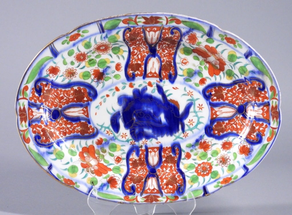 Meissen Type Imari Style Porcelain Platter: Germany,19th Century Center blue foo beast style medallion surrounded by polychromatic flower and butterfly patterns. Porcelain,Approx. 10 3/4" x 15". Marked with blue crossed swords on bottom. From t