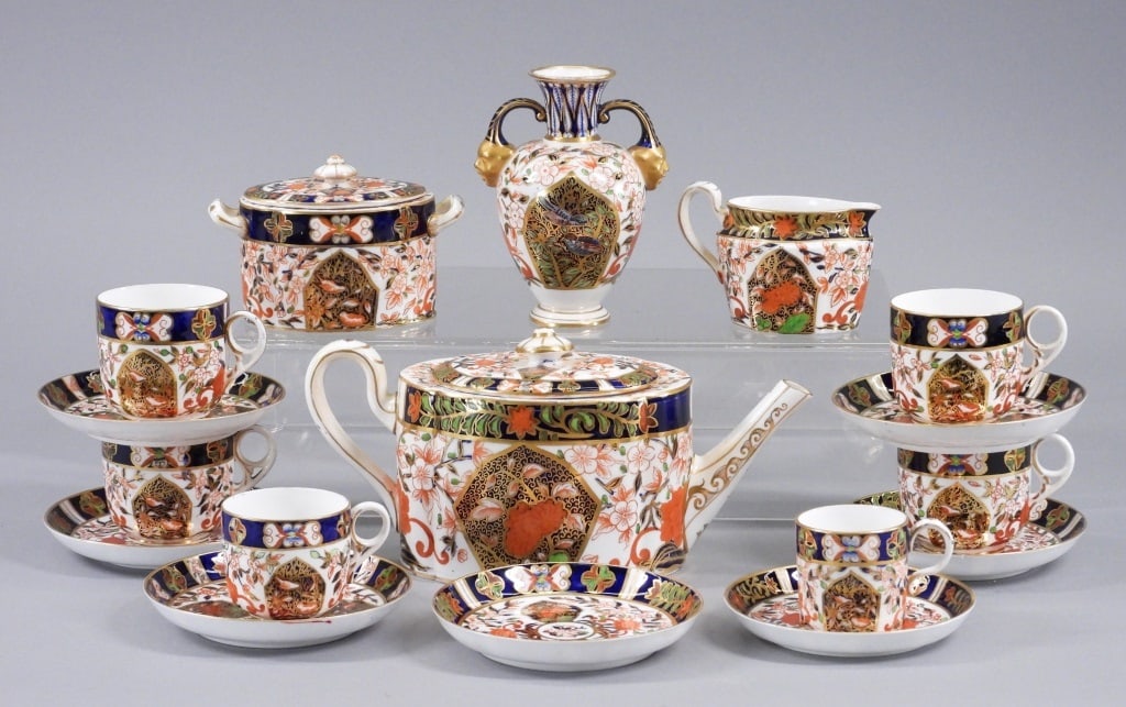 17PC Royal Crown Derby Imari Porcelain Dishware: England,Late 19th Century Includes a teapot, sugar bowl, creamer, seven saucers, four coffee cups, one tea cup, one espresso cup, and one vase in Imari pattern number 198. Porcelain,Smallest 2 1/4" x