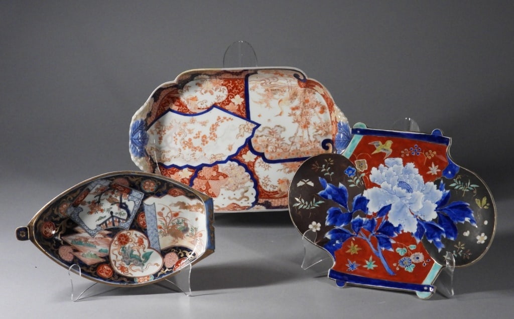 3PC Japanese Imari Porcelain Serving Plates: Japan,19th Century Includes a figural boat plate, a shapely plate with central blue peony, and a serving tray with with crane and flower patterns. Porcelain,Smallest 6 3/4" x 11 1/4".Largest 10 1/2" x