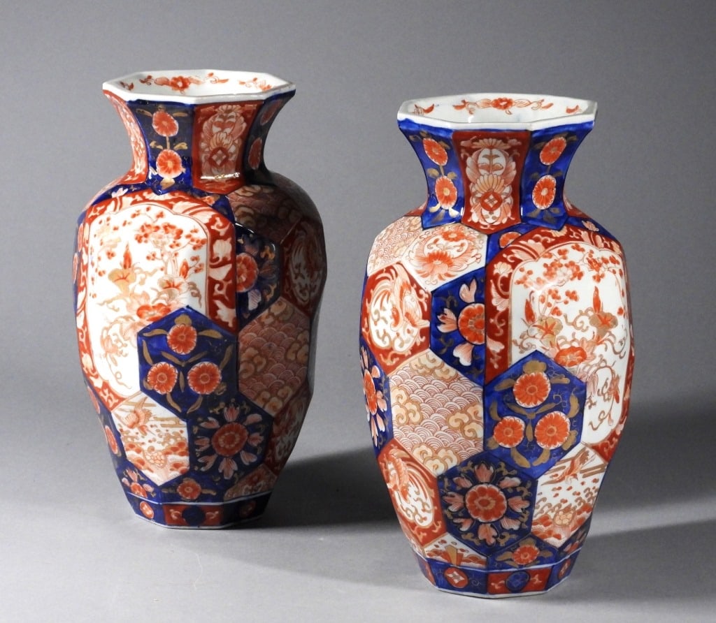 PR Japanese Imari Porcelain Vases: Japan,Late 19th Century Octagonal rim vases with numerous cartouches depicting flowers, cranes, and phoenixes. Porcelain,Each approx. 12" x 6 1/2" dia.. From the collection of a Jamestown, Rhode Islan