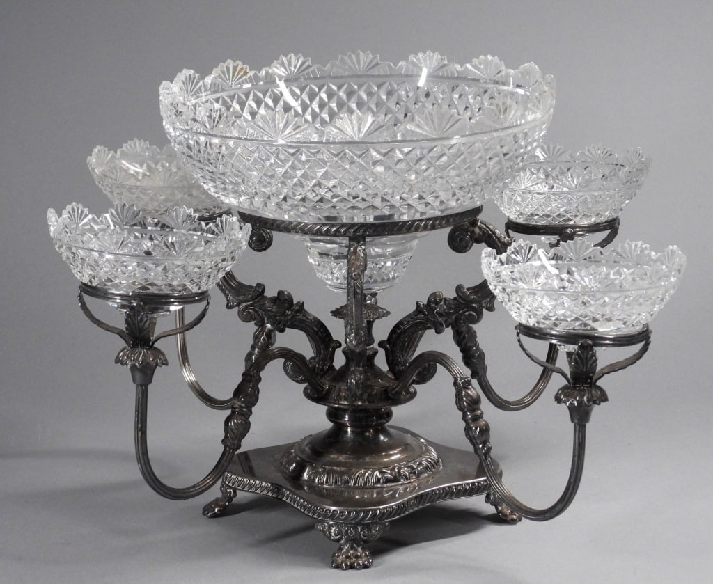 Israel Freeman & Son Silverplate & Glass Epergne: England,19th Century Large cut crystal center bowl with diamond pattern and four smaller matching bowls set in ornate silver plated arms supported by claw feet. Silverplate, glass,Approx. 12 1/4" x 21