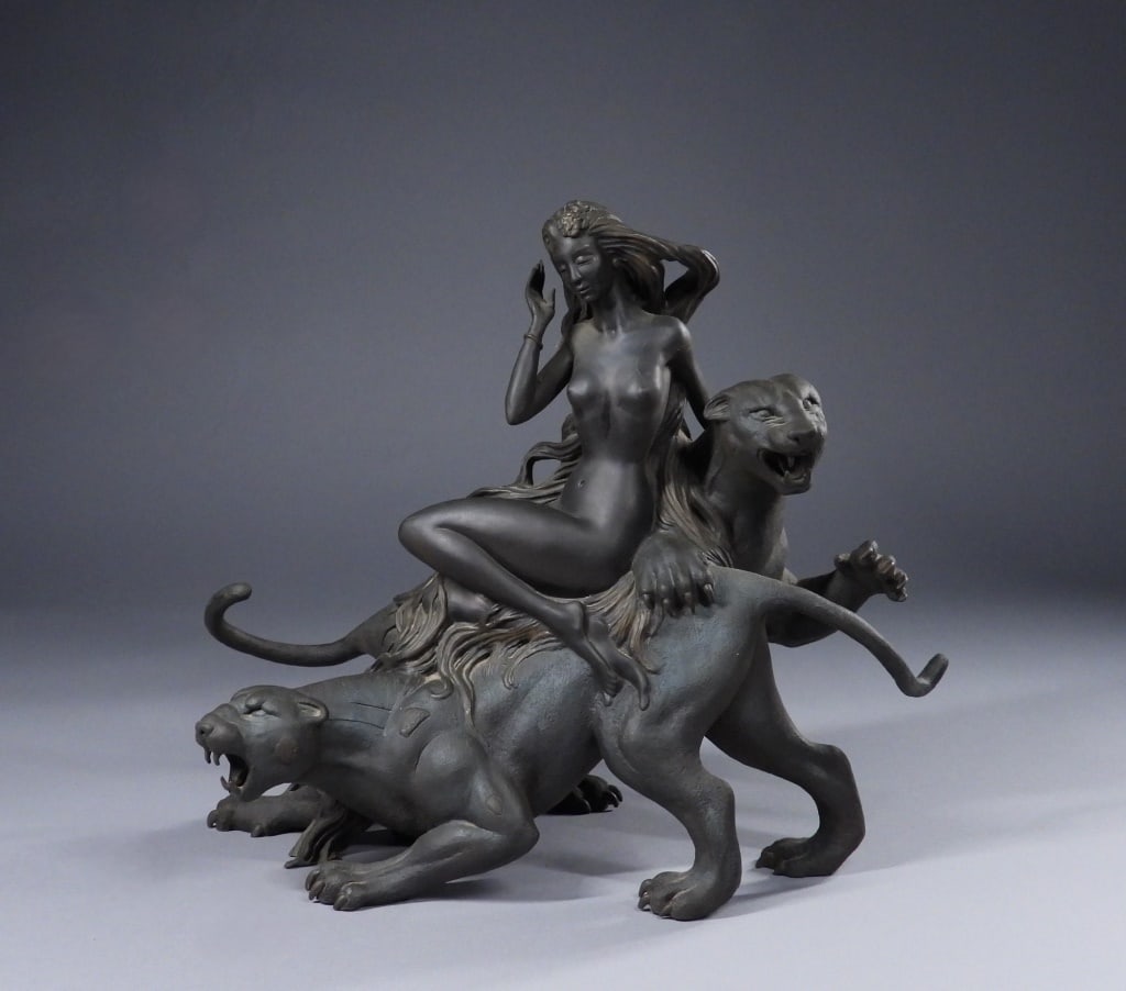 Tiefeng Jiang Mountain Ghost Bronze Sculpture: Minnesota, China,b. 1938 Depicts a nude woman with long flowing hair seated on the back of a ferocious leopard, gently caressing the neck of her second snarling feline companion. The work is based on