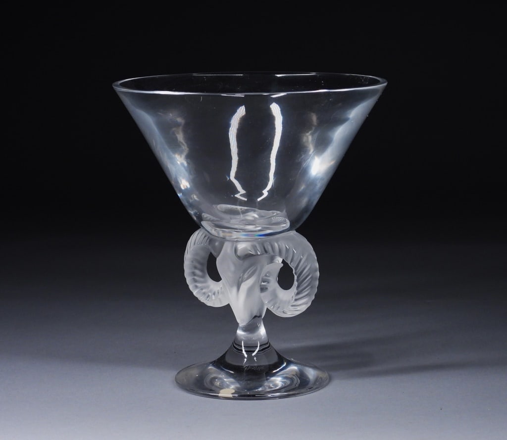 Lalique Aries Frosted Ram Art Glass Vase: France,20th Century Wide rim colorless glass vase over figural frosted glass ram head column supported by round foot titled "Aries." Lalique was founded in 1888 by renowned jeweler and glassmaker Rene