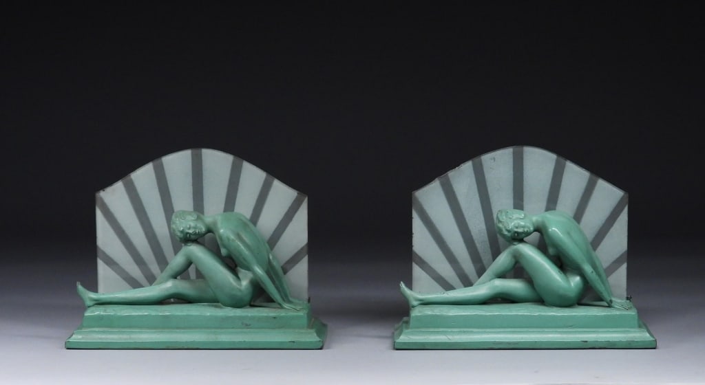 PR Bugbee & Niles Co. Frank Art Type Lamps: Massachusetts, Rhode Island.,1929 Each depicts a seated female nude figure with face pressed against a bent knee in front of a star burst glass screen. Open from 1859 to 1943, Bugbee & Niles was one o
