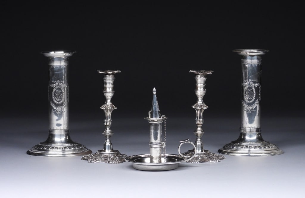 5PC Sterling & Coin Silver Candlesticks: England,Early 20th Century Includes a pair of ornate candlesticks with thin shapely columns by J.B. Chatterley & Sons, a pair of Bigelow, Kennard & Co. cylindrical candlesticks (weighted), and a Lows,