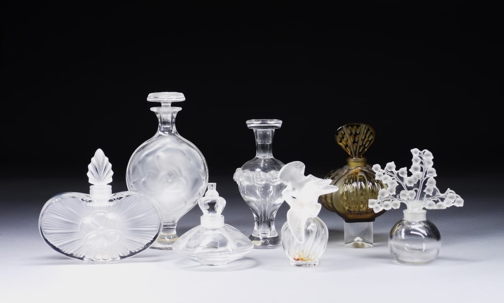 7PC Lalique Frosted Glass Perfume Bottles: France,20th Century Includes L'Air du Temps, Stupa Crown, Mirabel, Martine, Clarisse, Moulin Rouge, and Clairefontaine perfume bottles. Lalique was founded in 1888 by renowned jeweler and glassmaker R