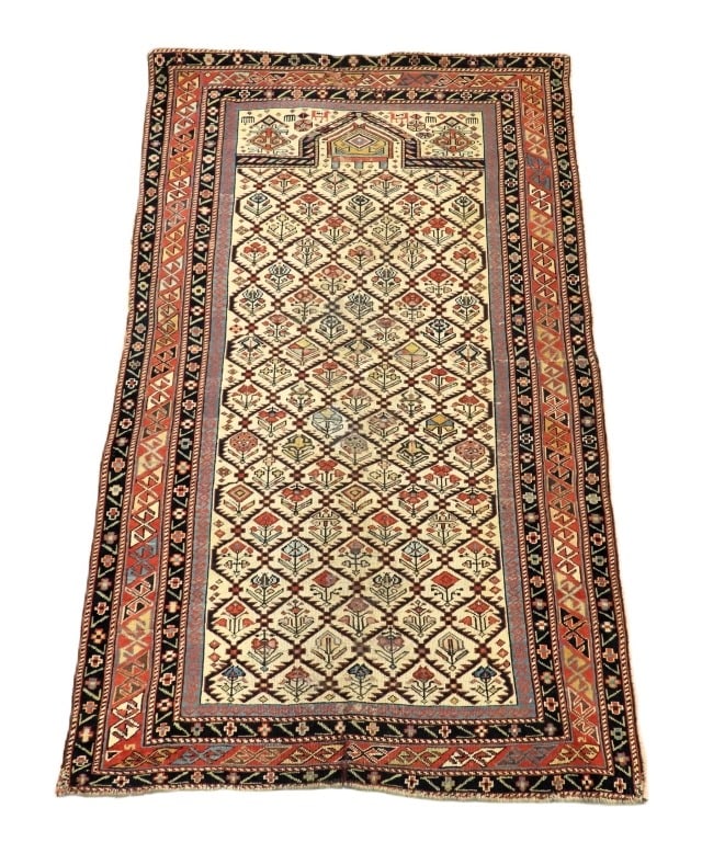 Antique Dhagestan Prayer Rug: Middle East,Early 20th Century Brown, red, blue, navy blue, and ivory repeating botanical pattern over ivory field surrounded by geometric boarders. Wool,Approx. 4' 9" x 2' 11". From the collection of