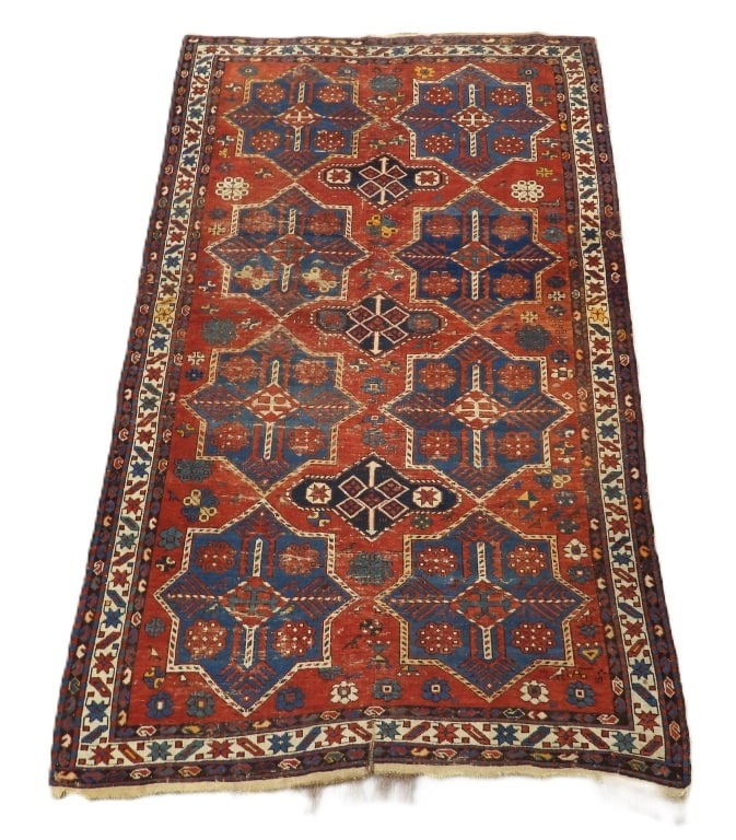 Antique Shirvan Carpet Rug: Caucuses,19th Century Red, white, and blue repeating star pattern over red field surrounded by geometric boarders. Wool,Approx. 7' x 4' 5". From the collection of a Chestnut Hill Estate.