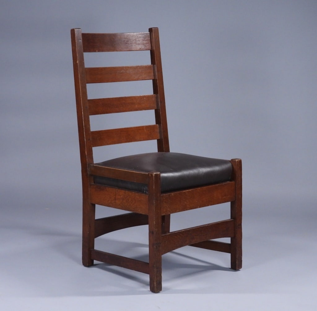 Gustav Stickley Mission Oak Model 352 Chair: United States,Early 20th Century Ladder back oak chair with brown upholstered seat over solid base and peg constructed. Oak,Approx. 36" t x 18 1/2" w x 17" d.17" Seat Height Branded signature on stret