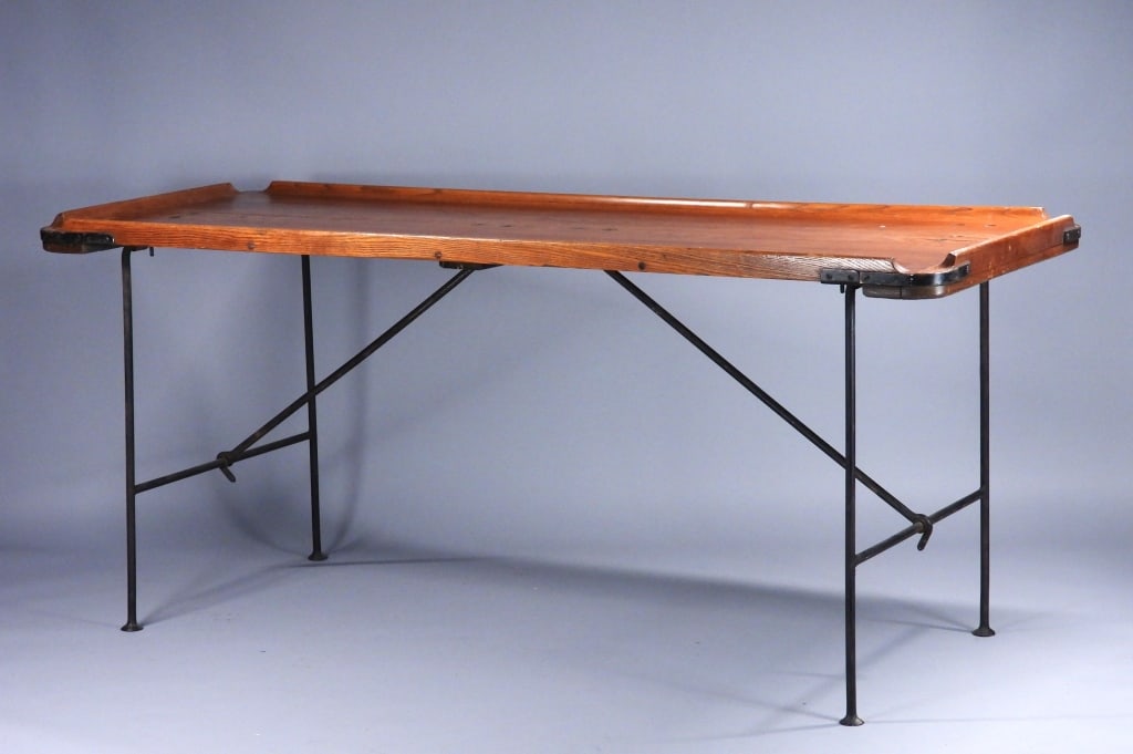 19C American Nautical Maritime Wrought Iron Table: United States,19th Century Heavy oak top work table, cleated on each side with wrought iron hardware and brass fasteners. Each corner relieved for drainage. Oak, metal,Approx. 30 1/2" t x 6' w x 27" d