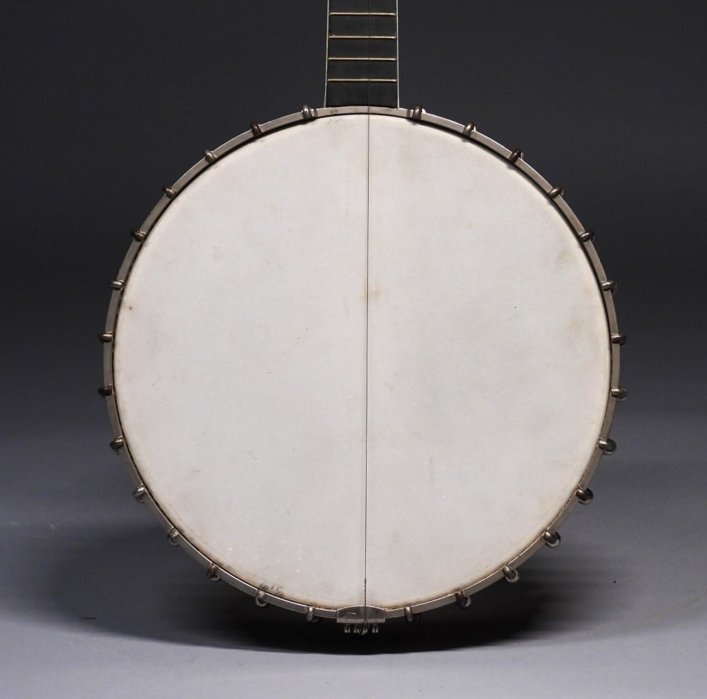 C1925 Vega Little Wonder Tenor Banjo: Massachusetts,Circa 1925 Four string tenor banjo with mother of pearl inlaid finger board. The Vega company was established in 1881 by Julius and Carl Nelson, and a group of associates in Boston Massa