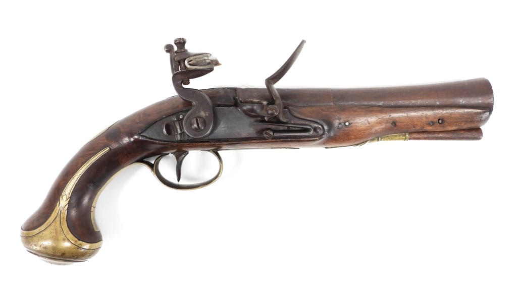 British Flintlock Coaching Pistol: England C. 1800 1.05 bore at the muzzle, NSN, walnut stock, brass fittings engraved with foliate designs, flat lock plate with a rear safety and indecipherable engraving, top flat of the barrel lightl