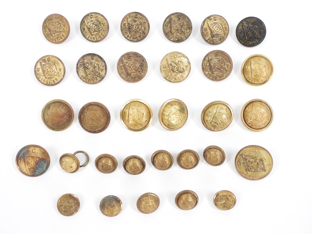 Group of United Confederate Veterans Buttons: United States Twenty large size U.C.V. buttons of both rounded and flatter-style; and eleven cuff-size buttons.