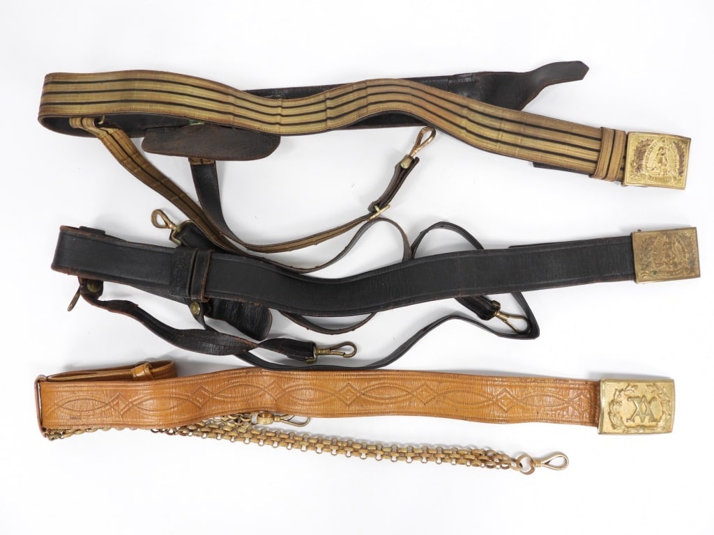 Three Post-war Virginia Officers Sword Belts: United States A black leather belt folded and sewn sword belt with a Virginia buckle and brass fittings; a brown-leather folded and sewn sword belt with metal linked sword hangers, and a buckle with a