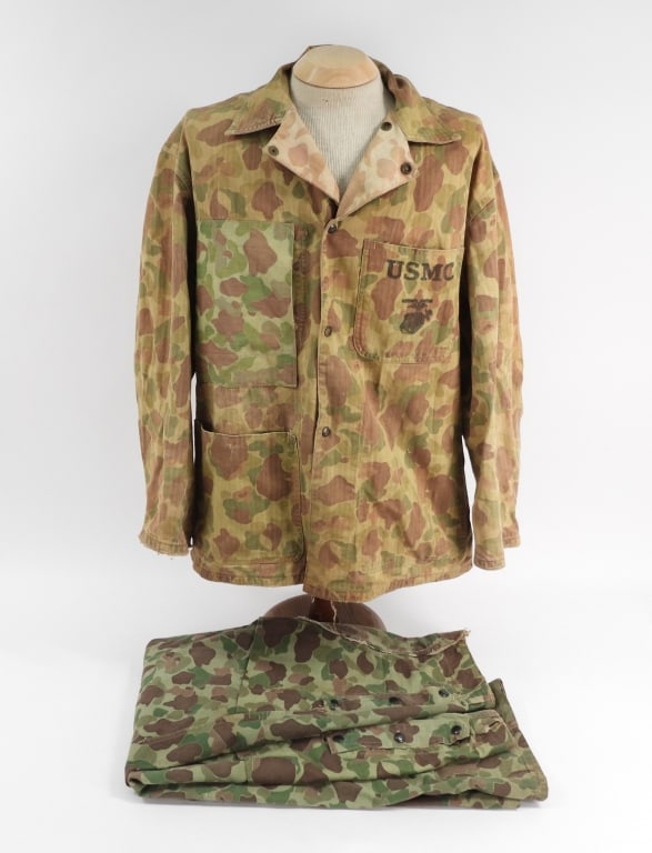 WWII USMC Camouflage HBT Jacket & Trousers: United States C. 1942-45 An M-42 HBT reversible jacket with "USMC" and an eagle, globe, and anchor printed on both of the breast pocket flaps, with an added breast pocket on the right side, and an add