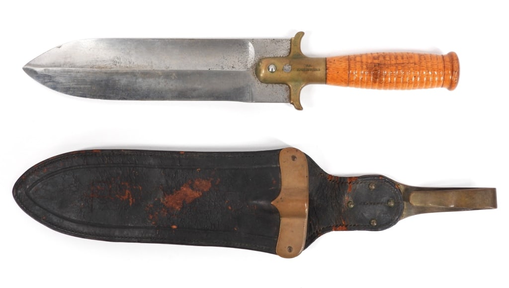 U.S. Model 1880 Hunting Knife: United States C. 1880s Turned wooden grip, brass ferule/guard marked "U.S./SPRINGFIELD" on one side, and "4398" on the other, steel double-edged blade, black leather scabbard with brass fittings, and 