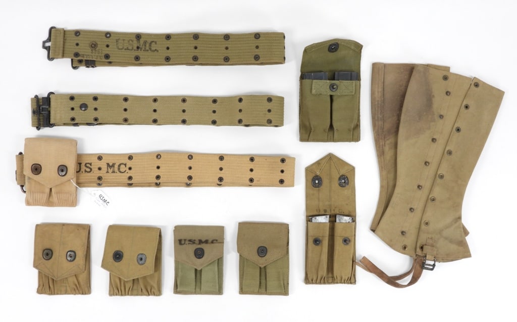 Group of USMC Web Gear: United States C. early to mid 20th century A pair of 1912-dated leggings marked "1/Phila. Depot"; three unissued 1911 pistol magazine pouches marked "U.S.M.C./PHILA. DEPOT" inside the flap; two-two to